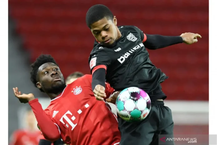 Bayern Munich's footballer, Alphonso Davies (left)