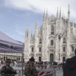 Soldiers patrol in front of Milan gothic cathedral, Italy