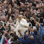 Pope Francis greets the faithful