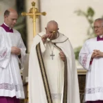 Pope Francis sprinkles holy water