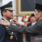 President Joko Widodo confers the rank of Air Chief Marshal TNI on Mohammad Tonny Harjono